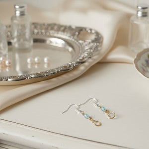 copper earrings with small aqua bead