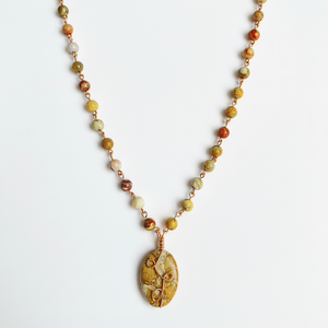 Clean flat-lay image of the Jasper oval pendant necklace